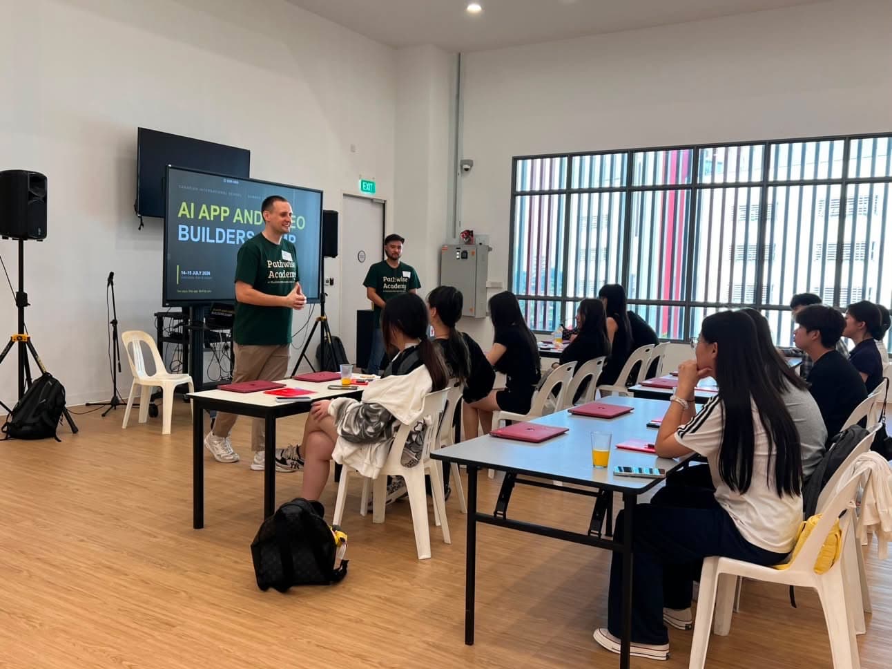 A Pathwise instructor briefing a room of secondary students at the start of an AI camp